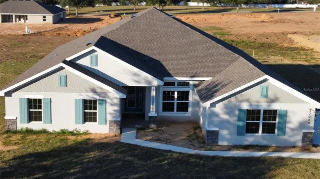 a view of house with yard