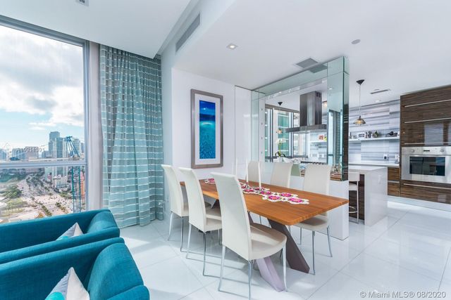 a kitchen with a sink cabinets and window