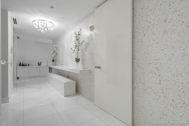 a bathroom with a sink and mirror