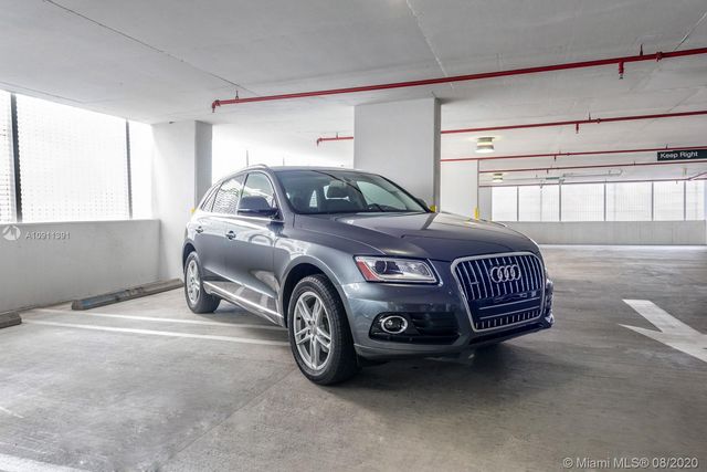 a car parked in a room next to a window