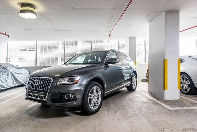 an aerial view of a house with outdoor space