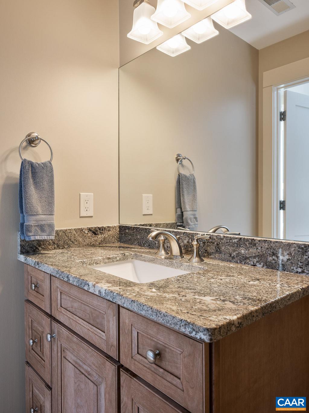 1125 Shiloh Road Charlottesville, VA 22903 - Photo 26 of 52 a bathroom with a granite countertop sink and a mirror
