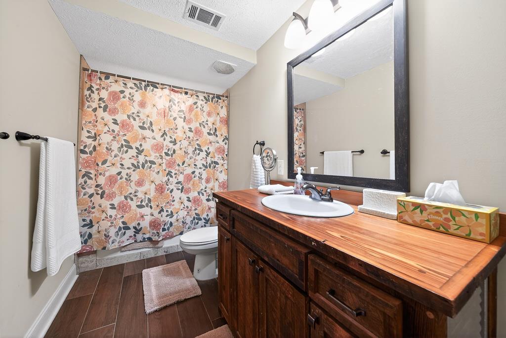 7333 Cedar Creek Loop Columbus, GA 31904 - Photo 33 of 37 a bathroom with a sink and a mirror