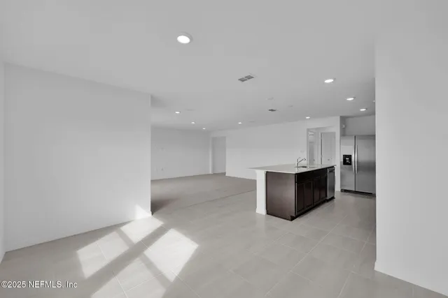 a view of a kitchen with a sink
