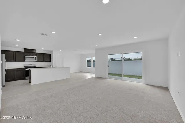 a living room with furniture and flat screen tv