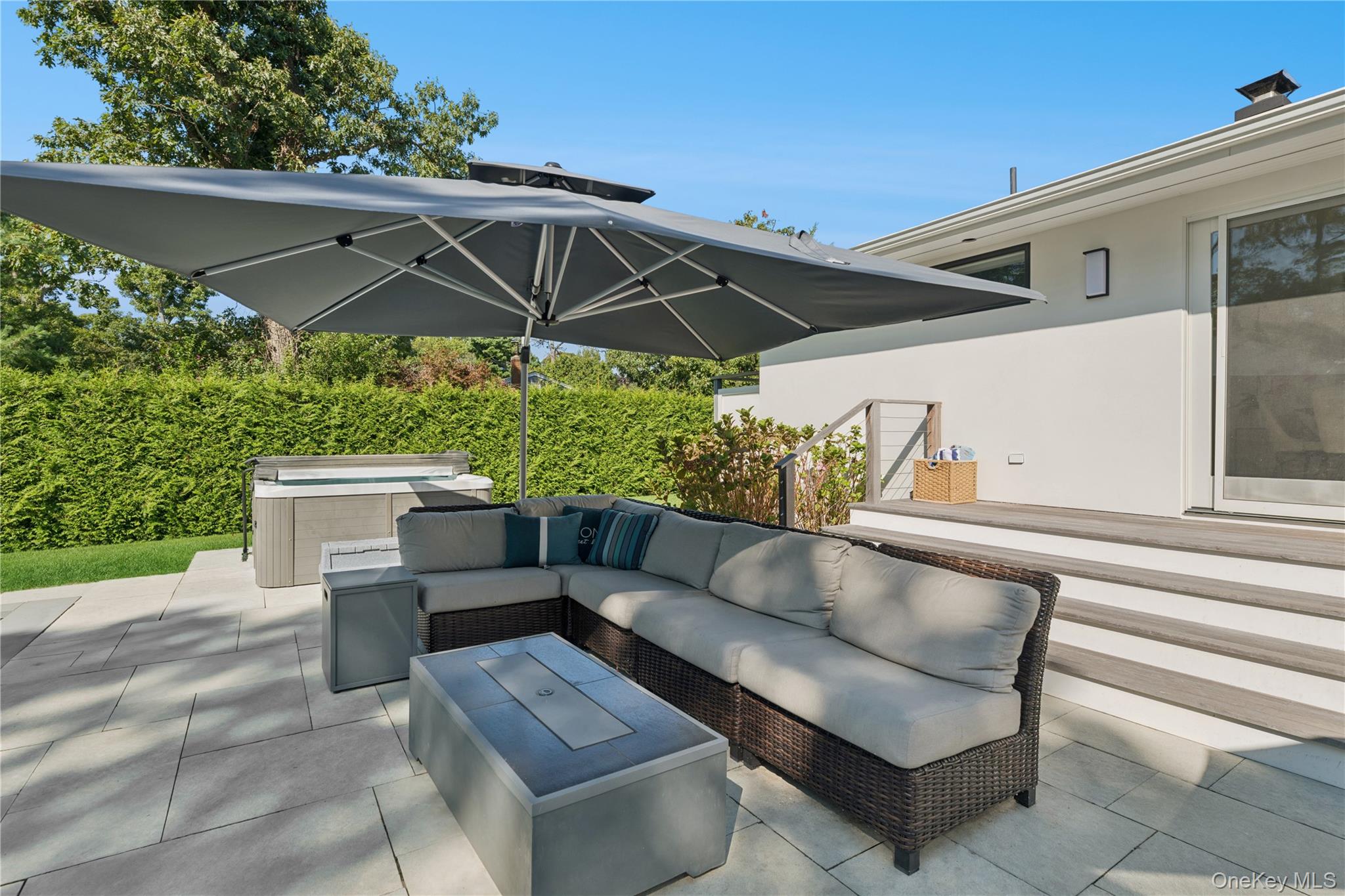 13 Sherwood Road Hampton Bays, NY 11946 - Photo 12 of 27 a view of backyard with outdoor seating and plants