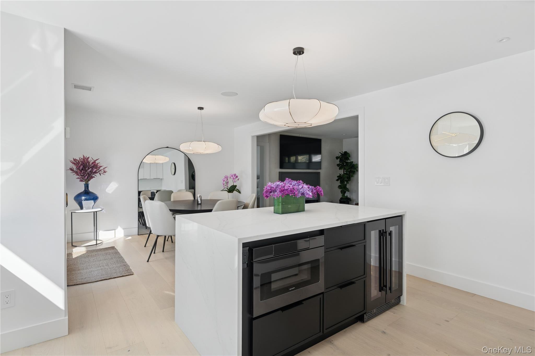 13 Sherwood Road Hampton Bays, NY 11946 - Photo 14 of 27 a view of a kitchen area with dining table and chairs