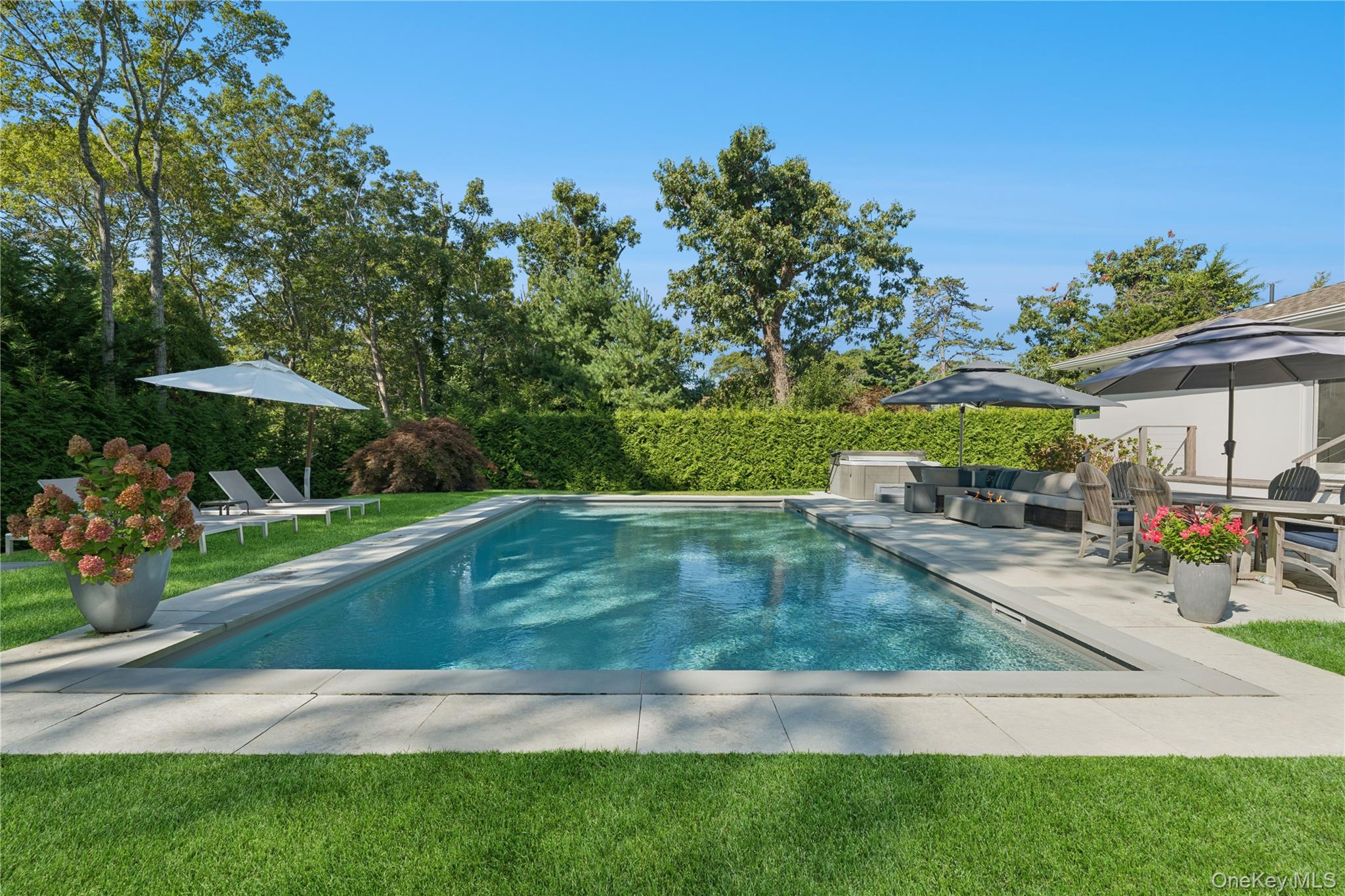 13 Sherwood Road Hampton Bays, NY 11946 - Photo 3 of 27 a view of a backyard with a patio