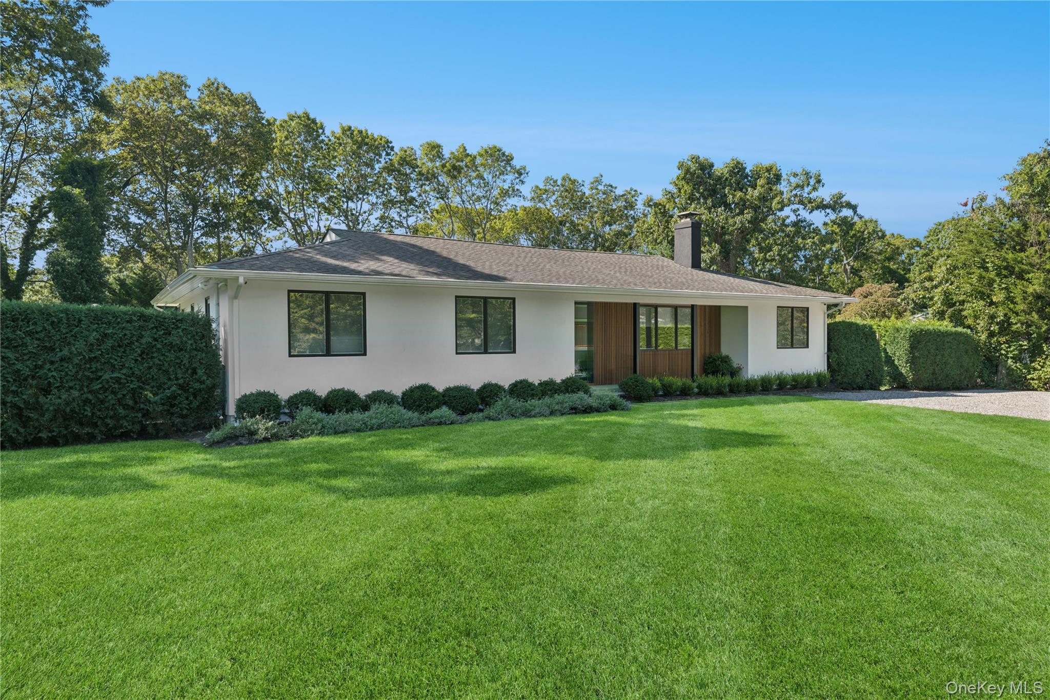 13 Sherwood Road Hampton Bays, NY 11946 - Photo 6 of 27 a view of a house with a backyard