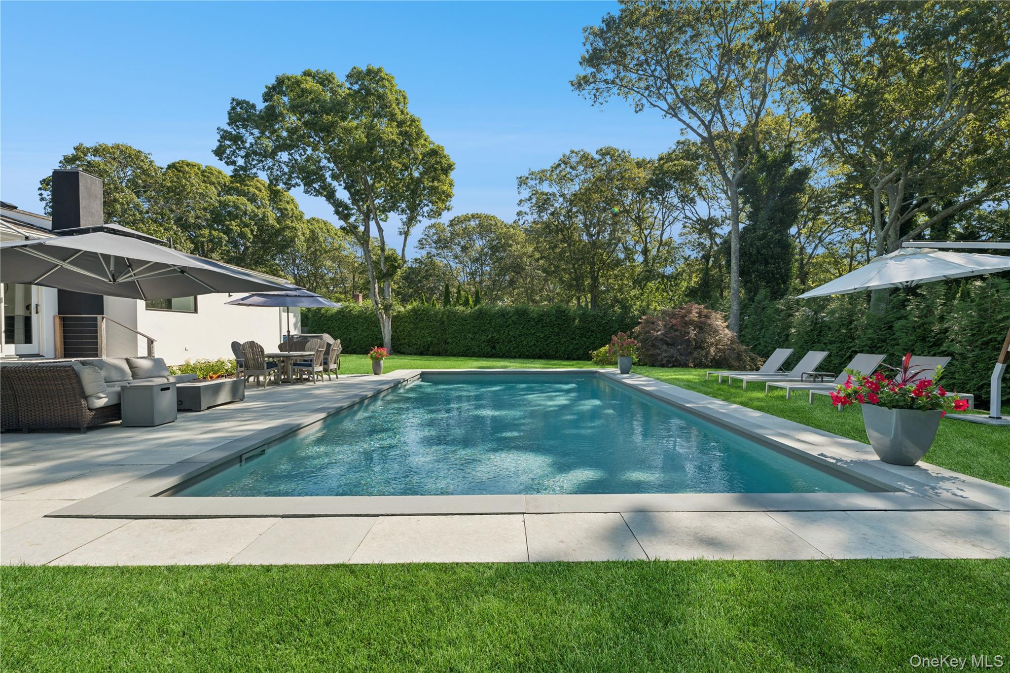 13 Sherwood Road Hampton Bays, NY 11946 - Photo 10 of 27 a view of yard with swimming pool and green space