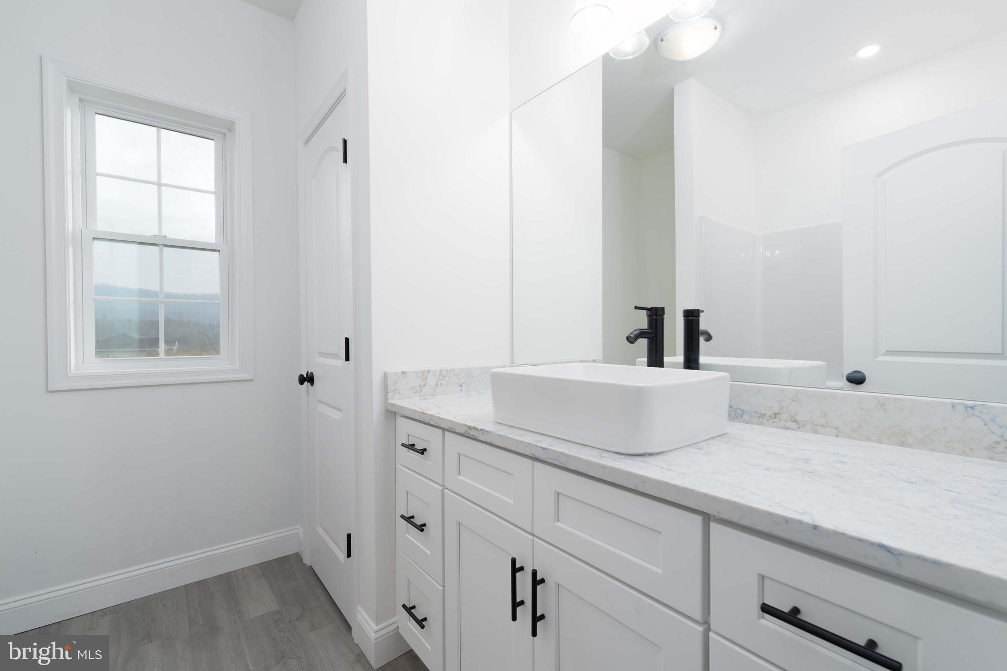 14 Jesse Road Halifax, PA 17032 - Photo 11 of 51 a bathroom with a sink and a mirror
