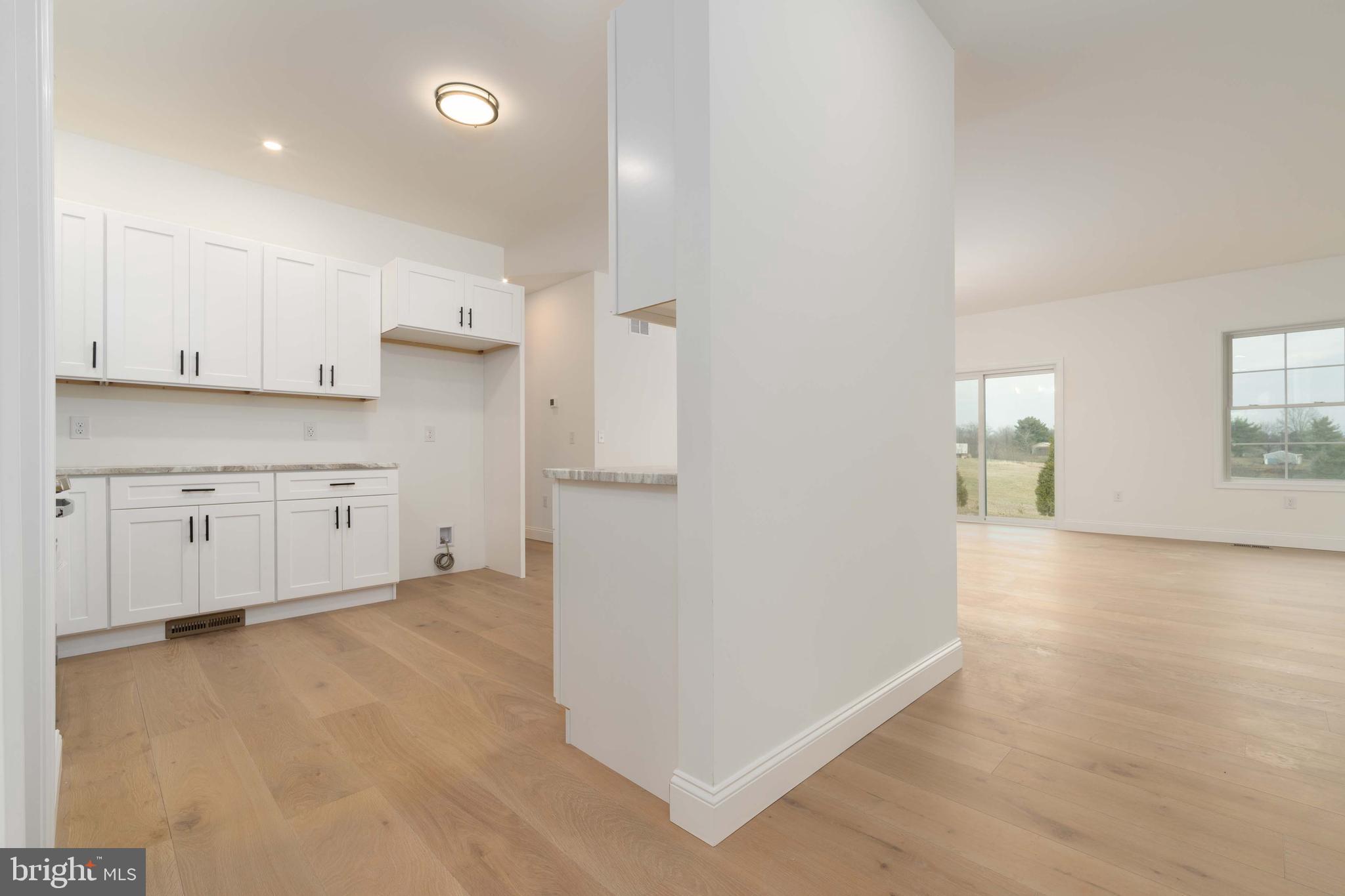 14 Jesse Road Halifax, PA 17032 - Photo 16 of 51 a view of a kitchen with white cabinets and a refrigerator