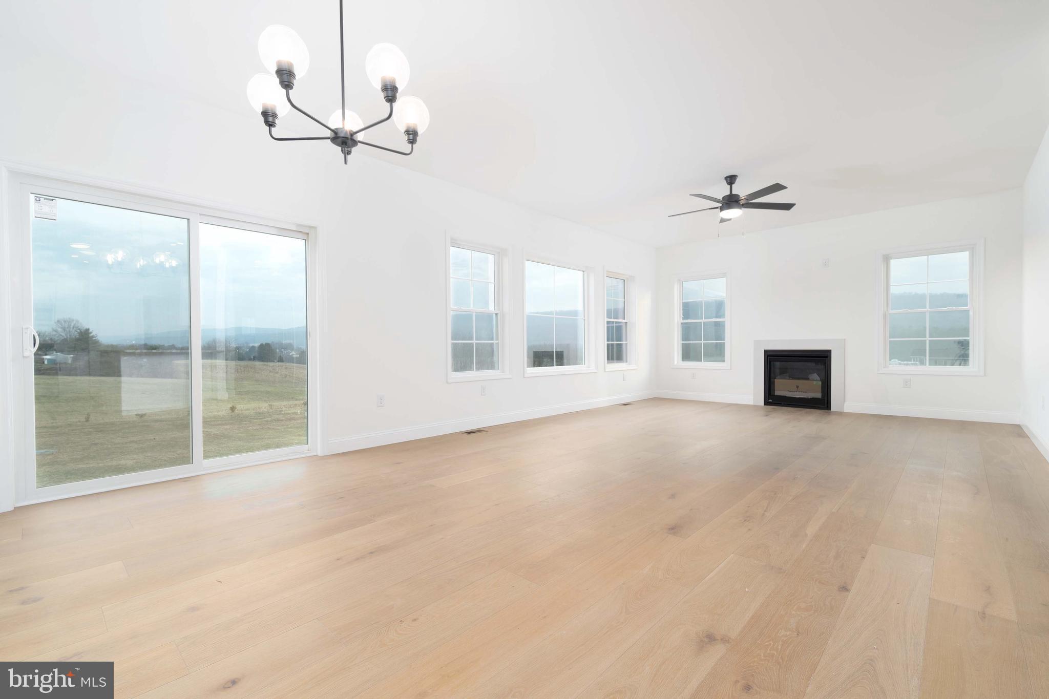 14 Jesse Road Halifax, PA 17032 - Photo 20 of 51 a view of an empty room with a fireplace and a window