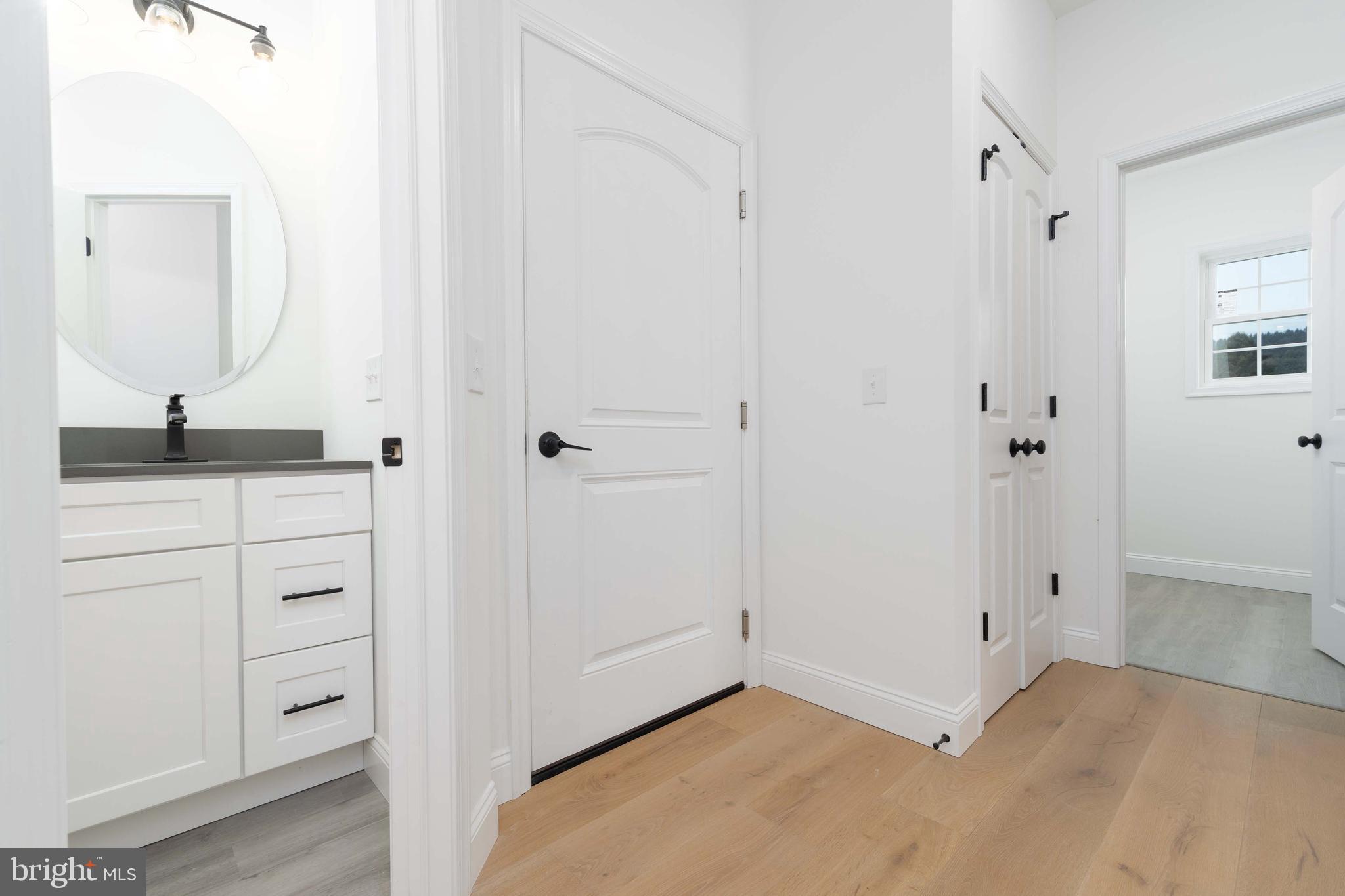 14 Jesse Road Halifax, PA 17032 - Photo 22 of 51 a bathroom with a granite countertop sink and a mirror