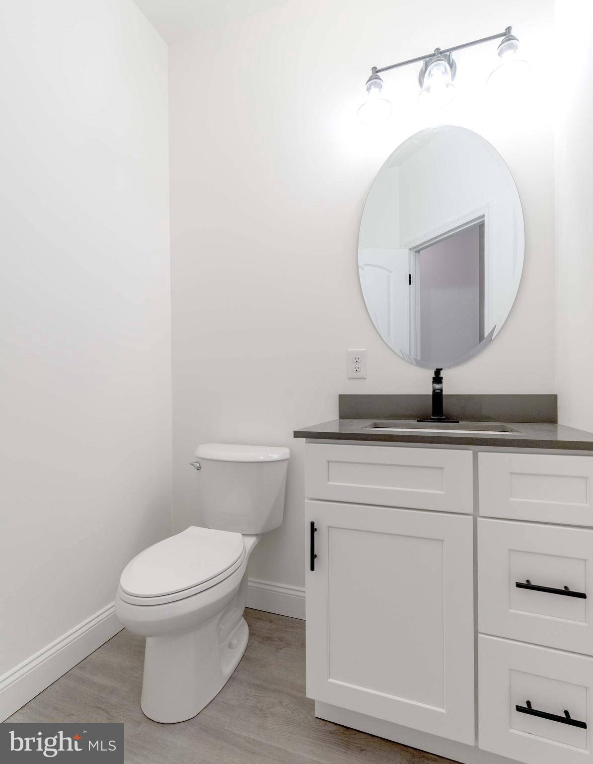 14 Jesse Road Halifax, PA 17032 - Photo 23 of 51 a bathroom with a toilet a sink and mirror