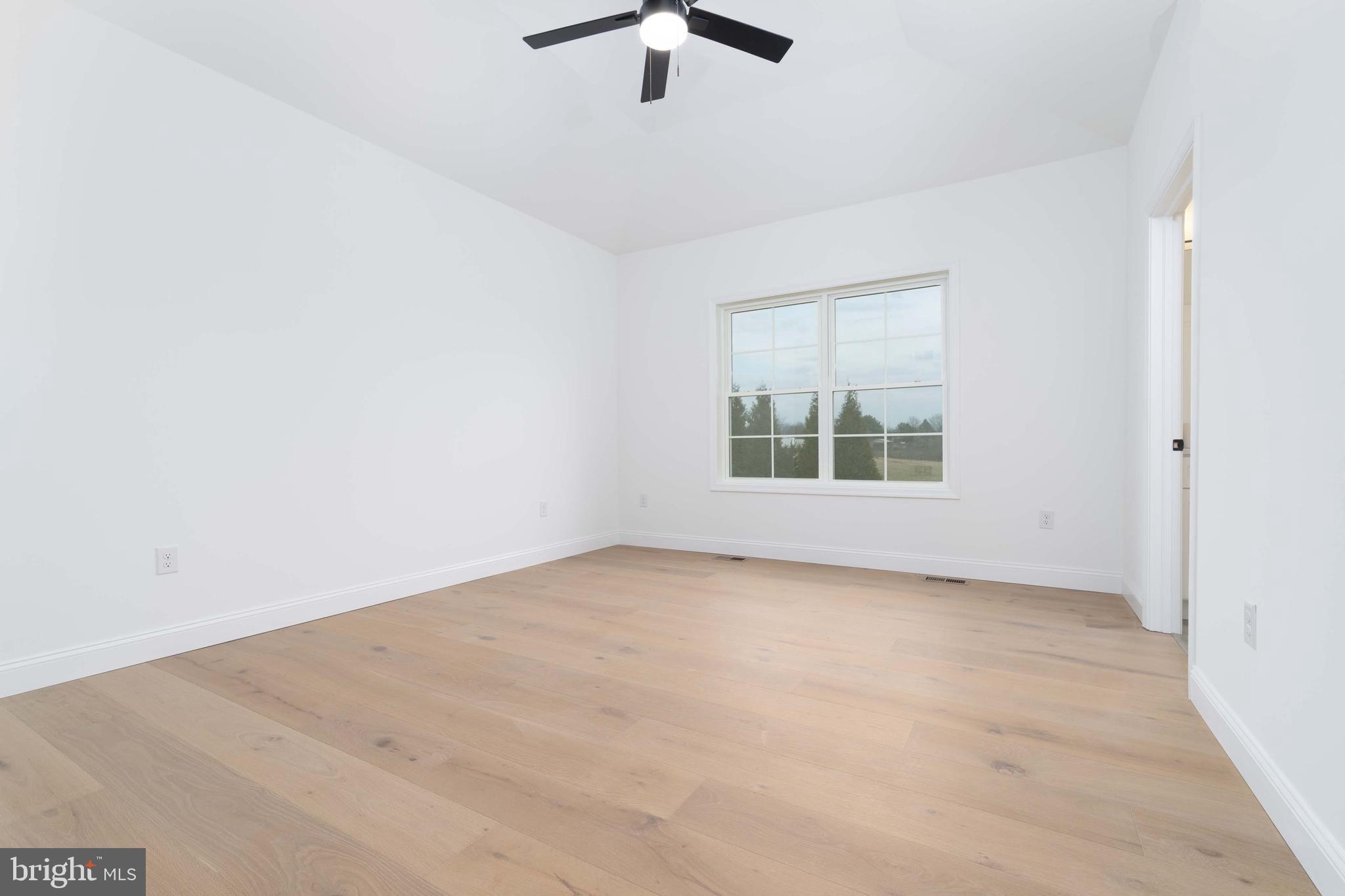 14 Jesse Road Halifax, PA 17032 - Photo 24 of 51 an empty room with a window and a ceiling fan