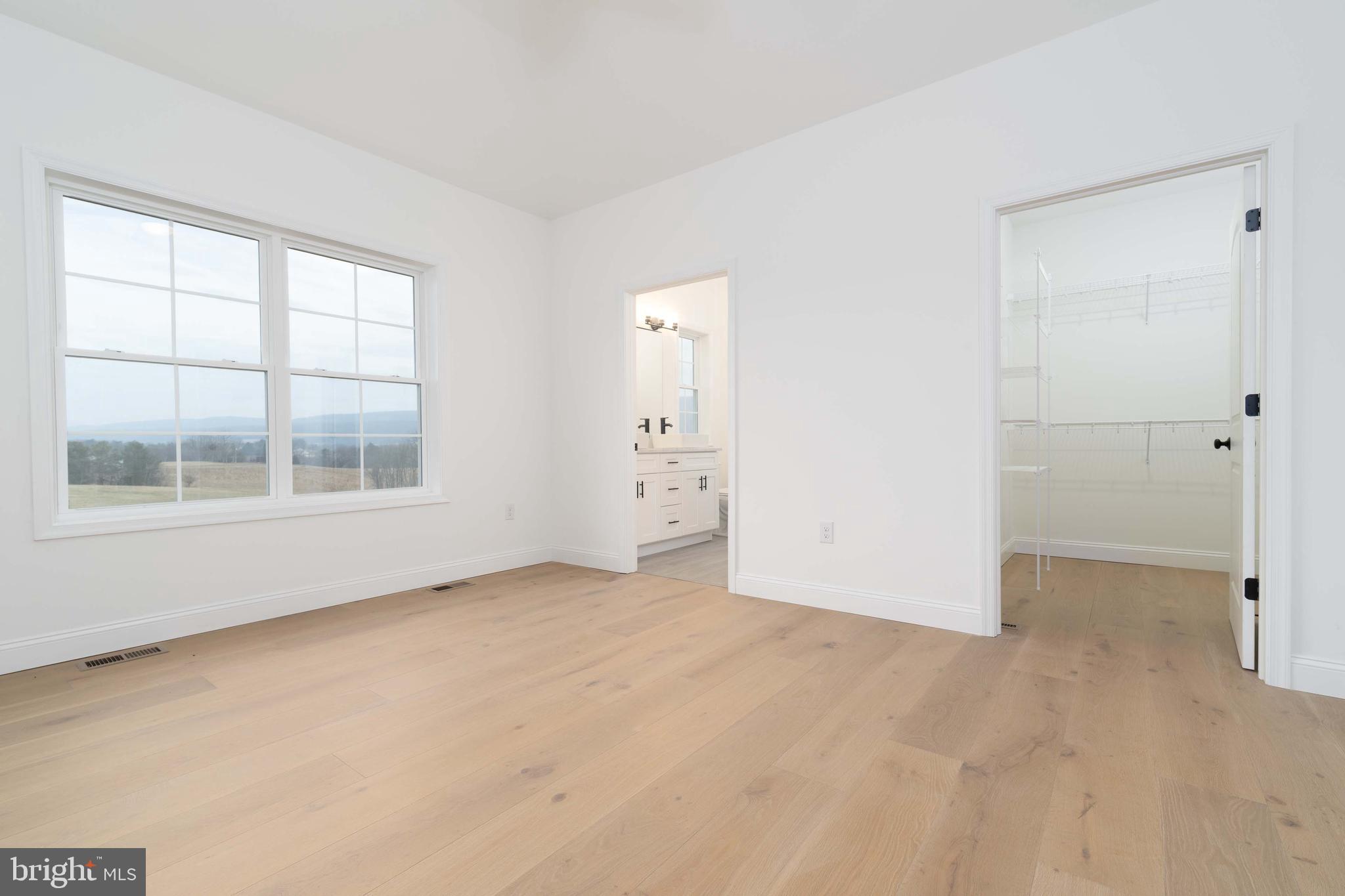 14 Jesse Road Halifax, PA 17032 - Photo 25 of 51 an empty room with windows and entrance to other room