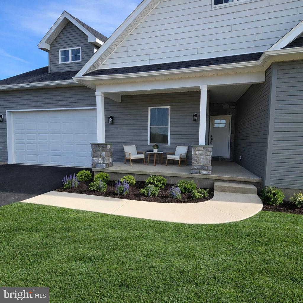 14 Jesse Road Halifax, PA 17032 - Photo 49 of 51 a front view of a house with a yard and potted plants