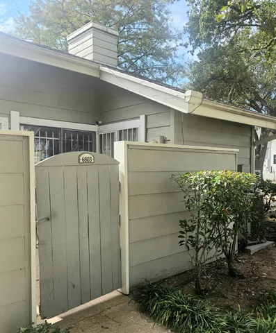a side view of a house with a yard