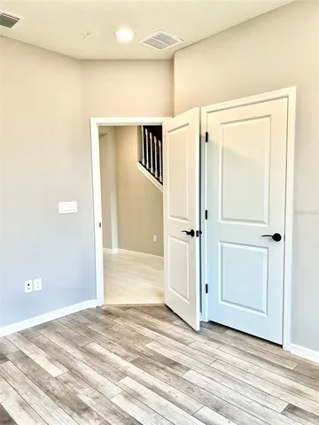 a view of a livingroom with wooden floor