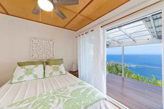 a bedroom with a bed and a table