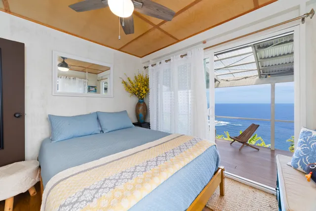 a bedroom with a bed and a table