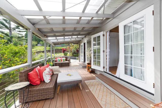 a view of balcony with couch and wooden floor