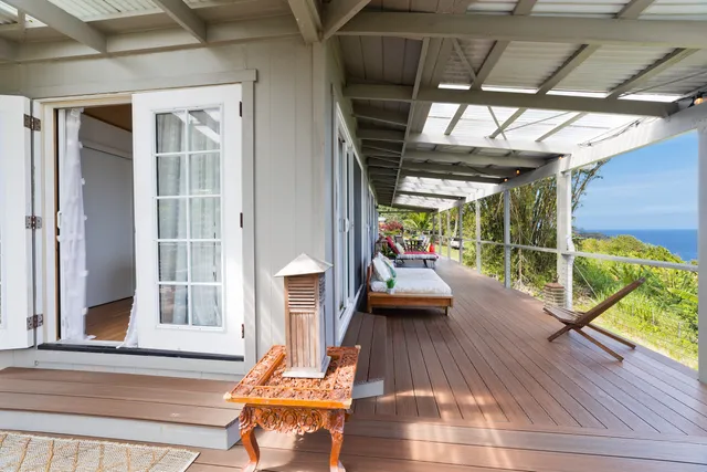 a view of a patio with wooden floor