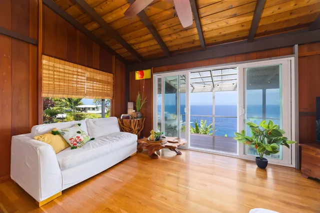 a building outdoor space with patio furniture and potted plants