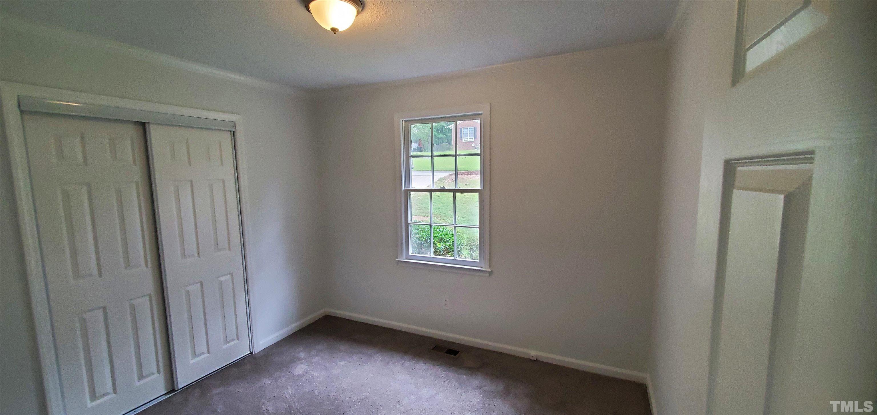 3817 Corwin Road Garner, NC 27529 - Photo 11 of 21 an empty room that has a window