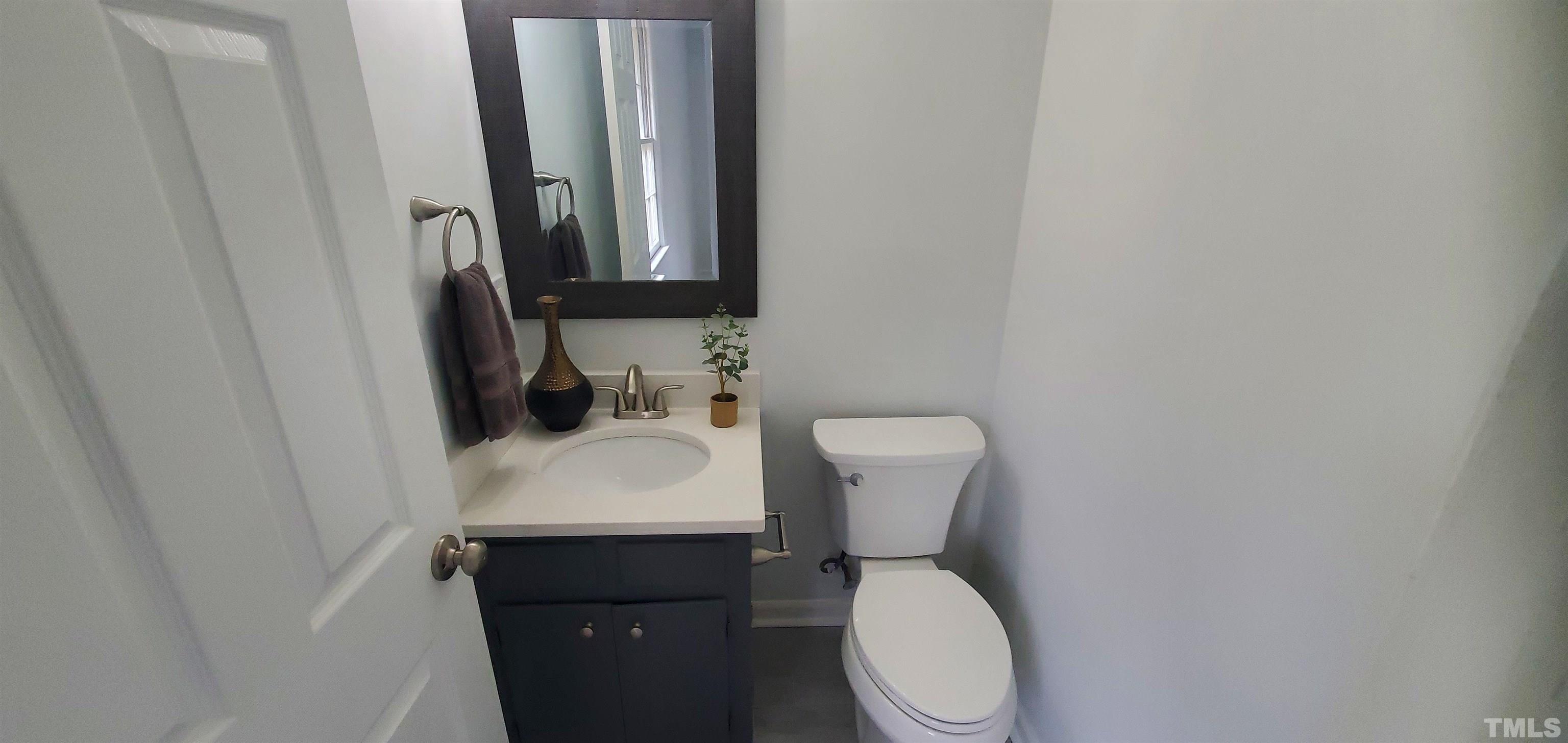 3817 Corwin Road Garner, NC 27529 - Photo 10 of 21 a white toilet sitting next to a white sink