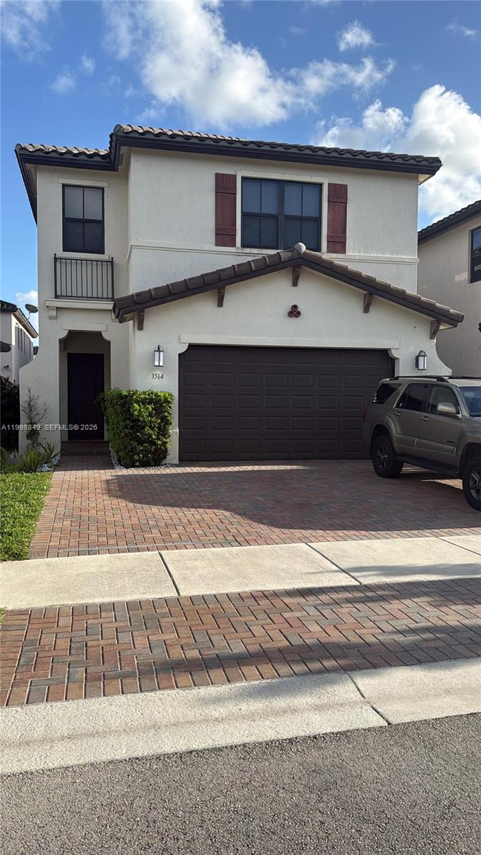 3564 West 97th Street Hialeah, FL 33018 - Photo 2 of 5 a front view of a house with a garage