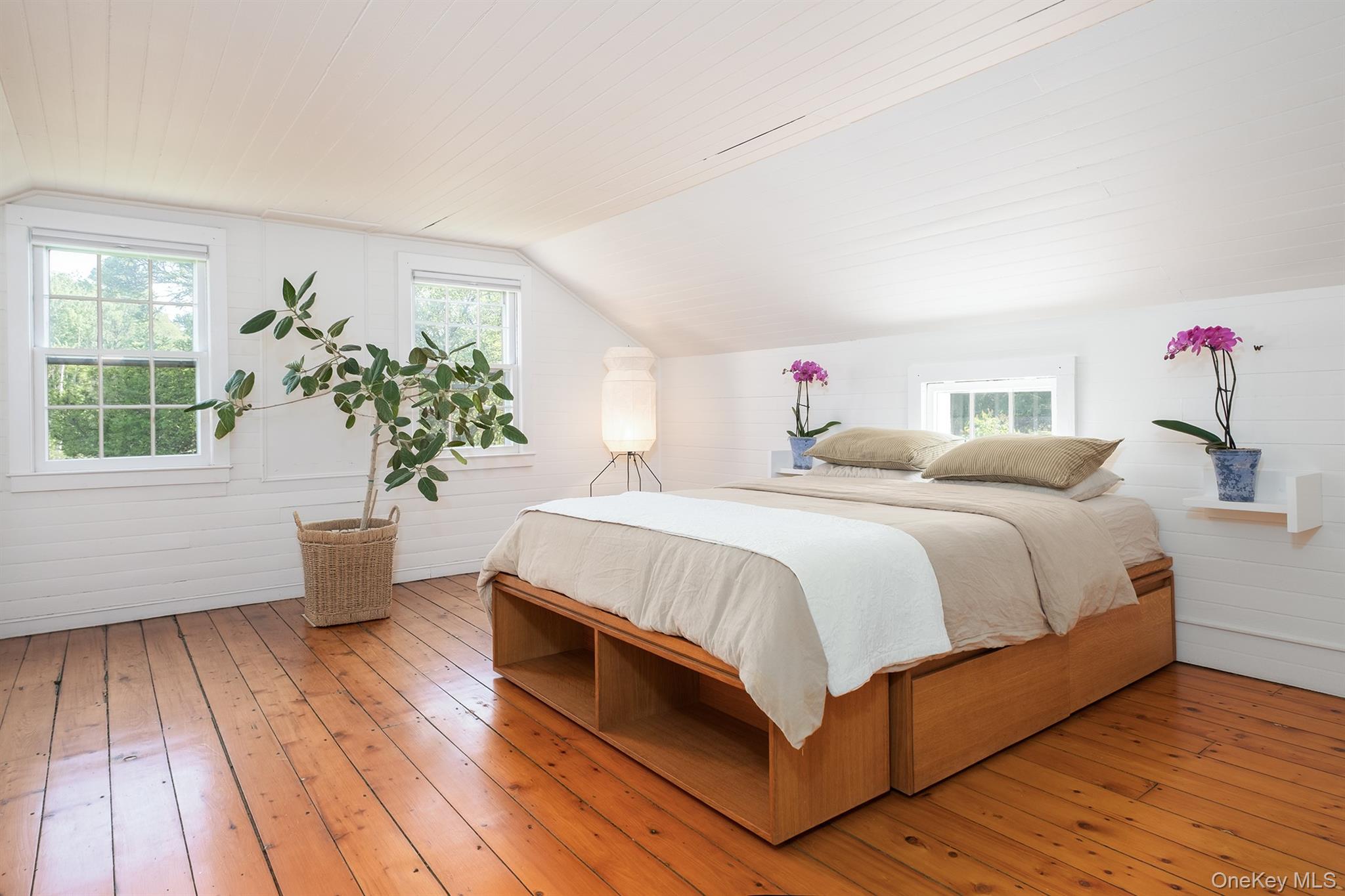 77 Upper Hook Road Rhinebeck, NY 12572 - Photo 21 of 48 a bed room with a bed and a potted plant