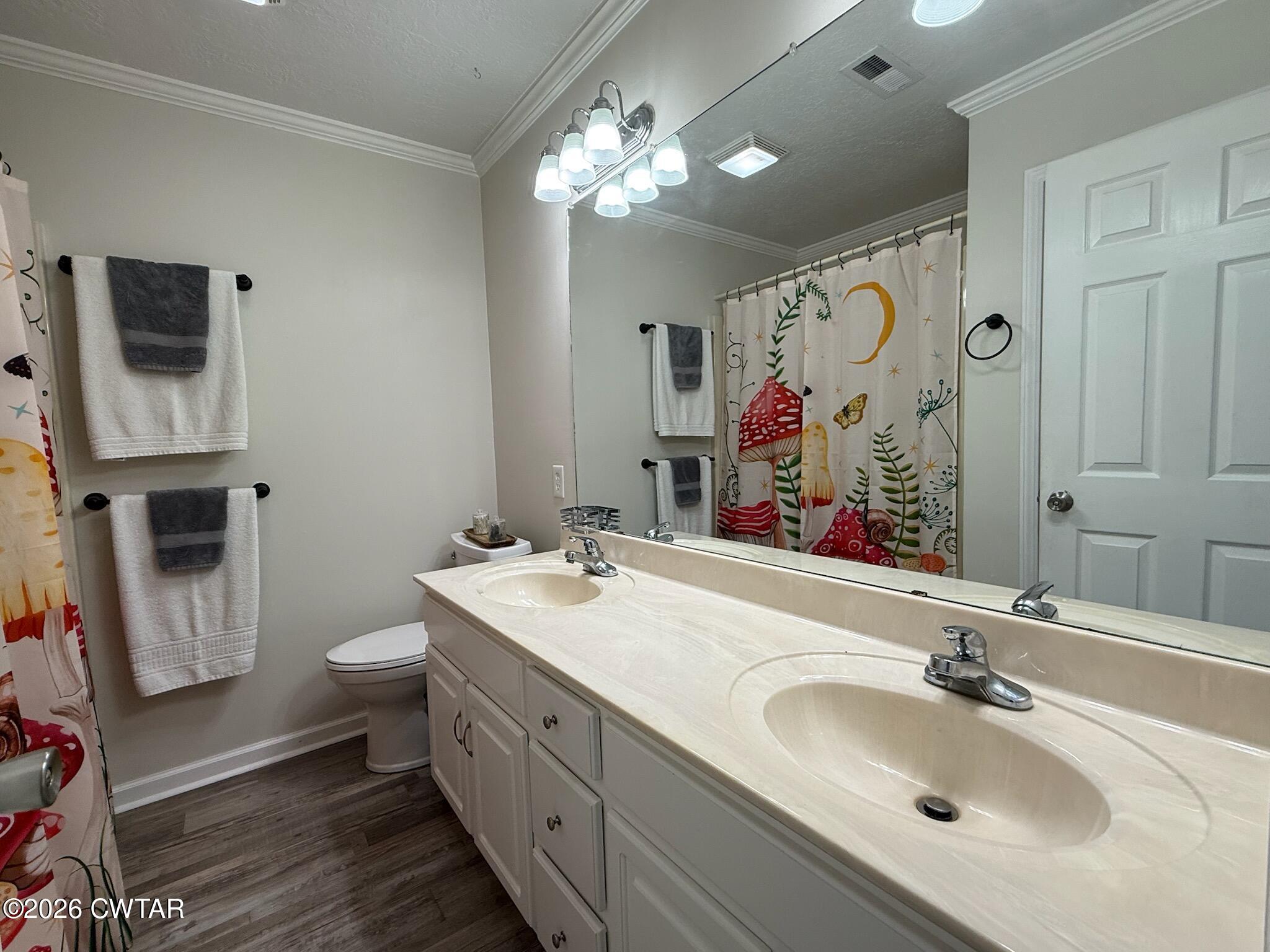 126 Waldunn Cove Rutherford, TN 38369 - Photo 9 of 18 a bathroom with a double vanity sink mirror and toilet