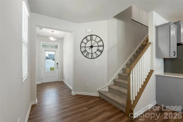 a view of entryway with wooden floor