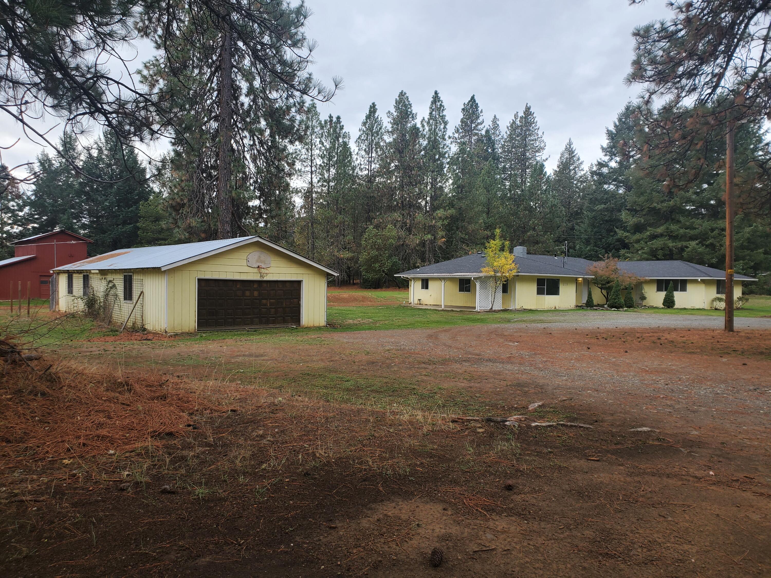 513 Queens Branch Road Rogue River, OR 97537 - Photo 1 of 56 a front view of house with yard and green space