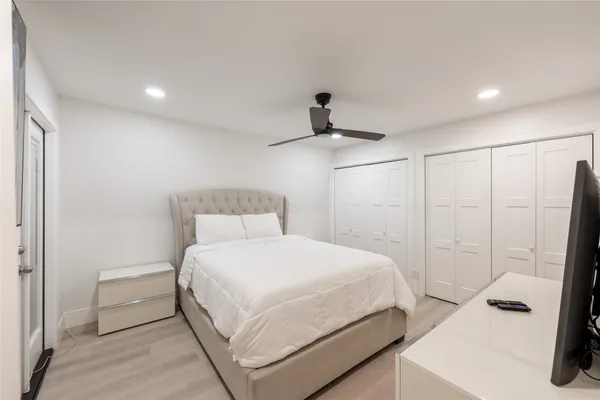 a bedroom with a bed and a walk in closet