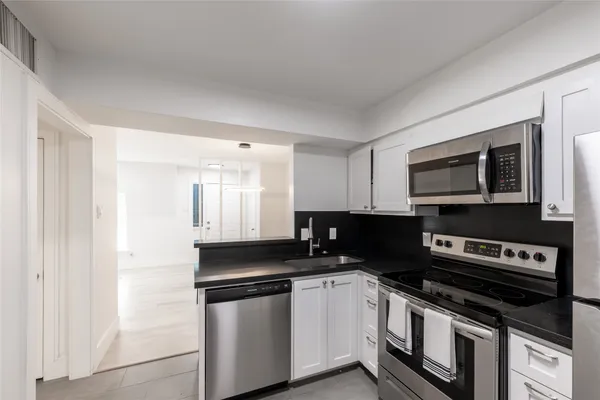 a kitchen with a stove and a microwave