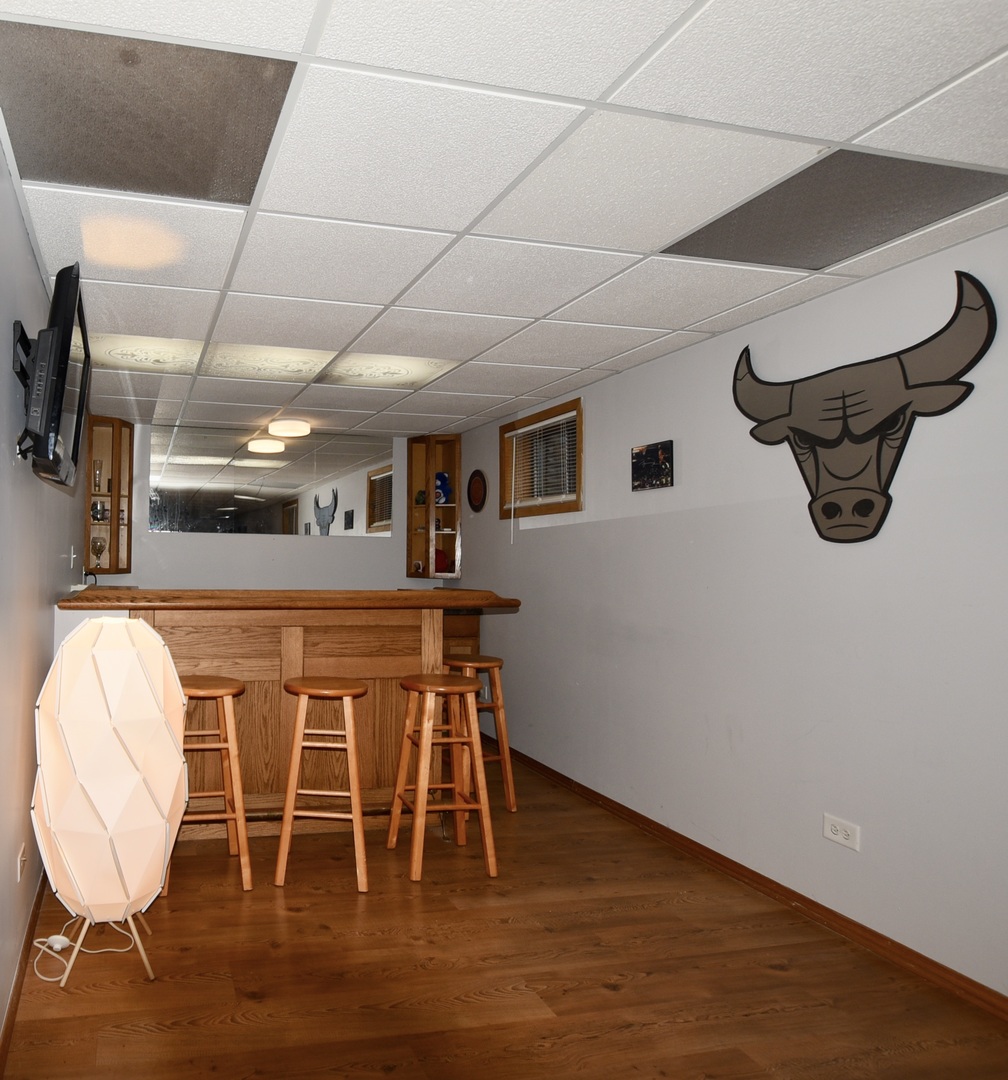 1011 Cardinal Drive Zion, IL 60099 - Photo 12 of 23 a dining room with furniture and wooden floor