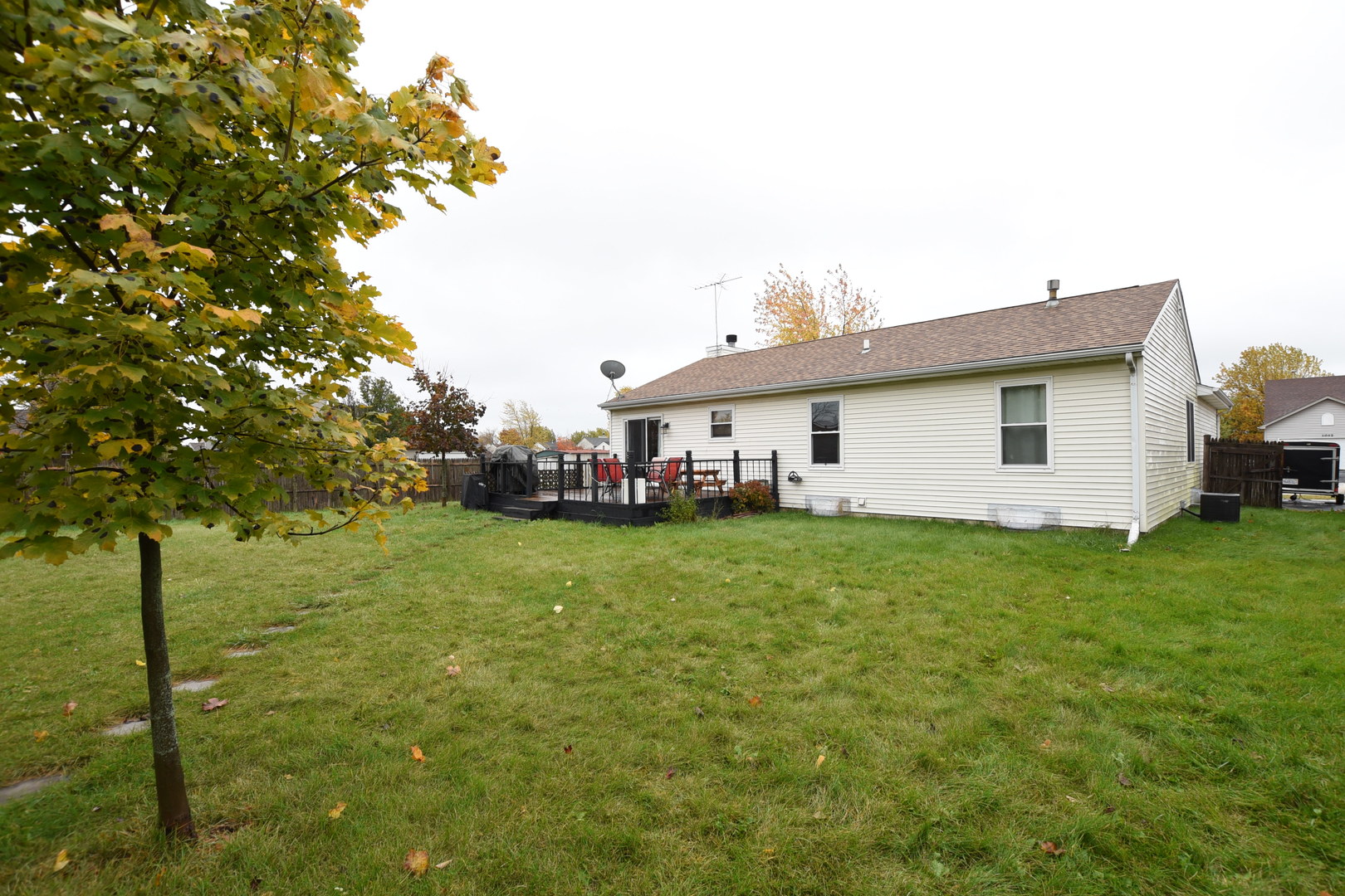 1011 Cardinal Drive Zion, IL 60099 - Photo 19 of 23 a view of a house with backyard and sitting area