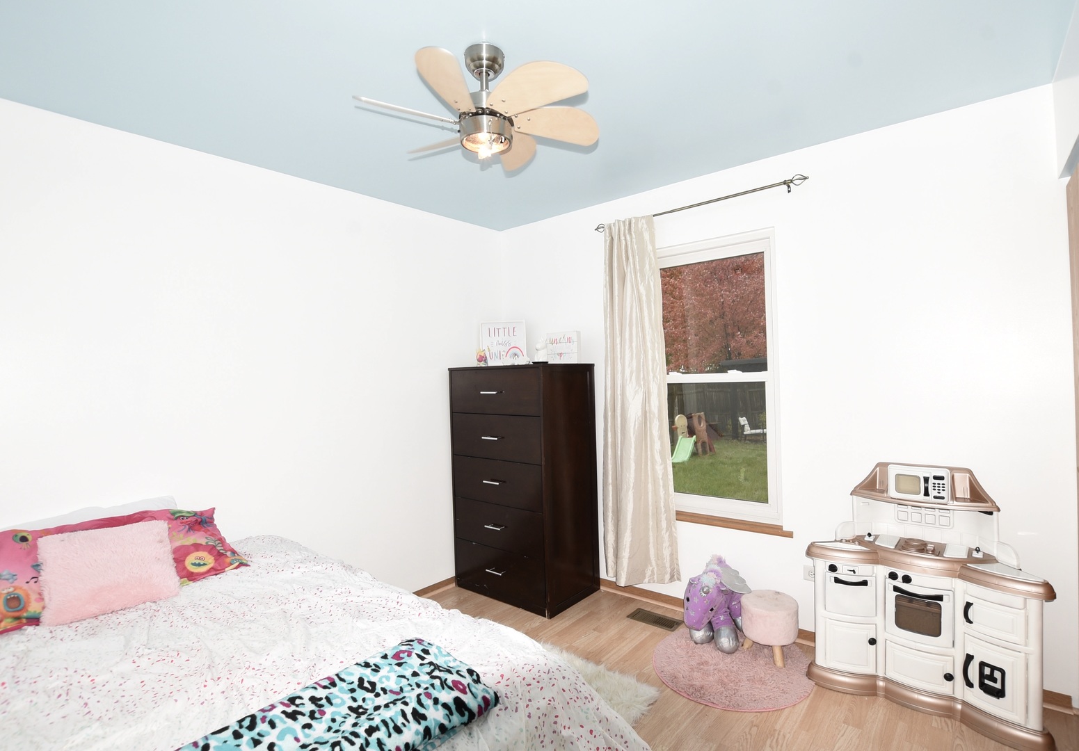 1011 Cardinal Drive Zion, IL 60099 - Photo 8 of 23 a bedroom with a bed and a dresser in it