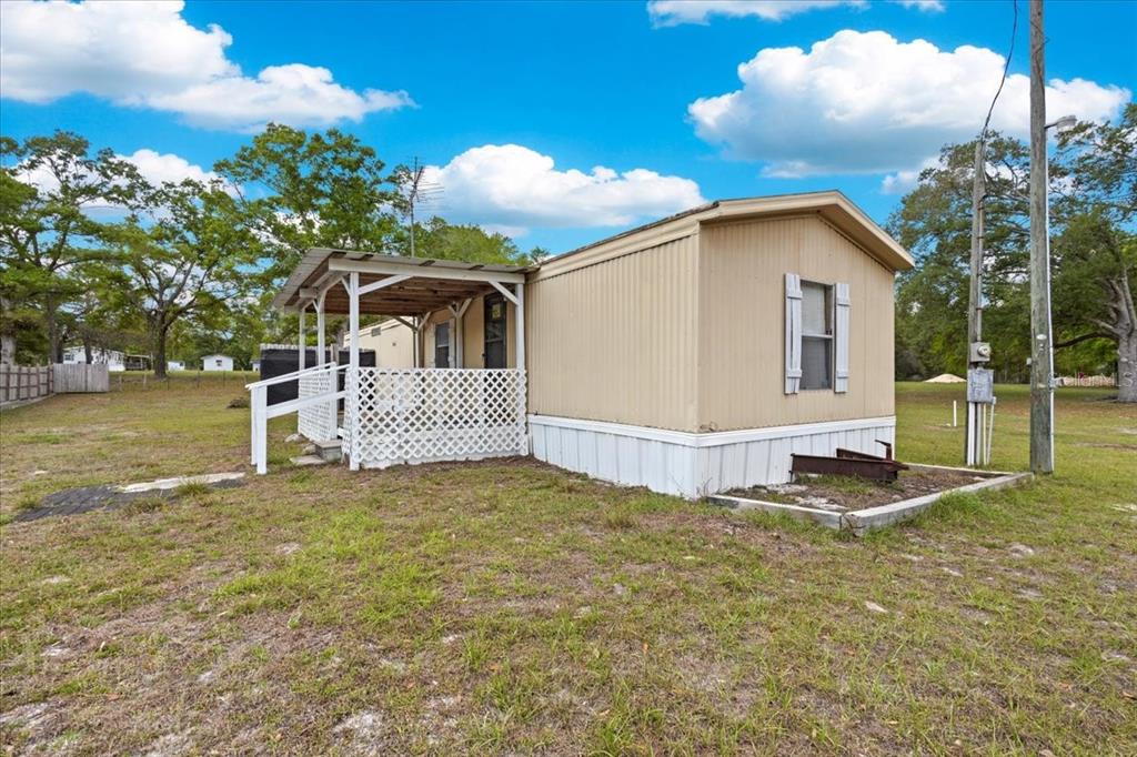 3100 Northwest 20th Street Bell, FL 32619 - Photo 2 of 39 a front view of a house with a yard