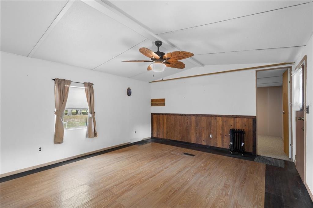 3100 Northwest 20th Street Bell, FL 32619 - Photo 24 of 39 an empty room with windows and ceiling fan