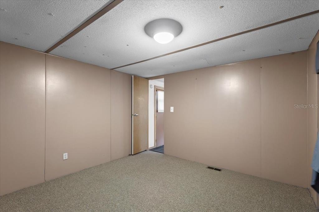 3100 Northwest 20th Street Bell, FL 32619 - Photo 25 of 39 an empty room with a space and windows