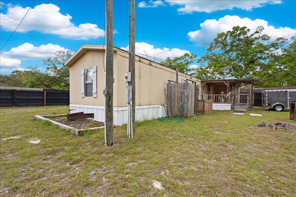 3100 Northwest 20th Street Bell, FL 32619 - Photo 6 of 39 a view of a house with backyard and porch