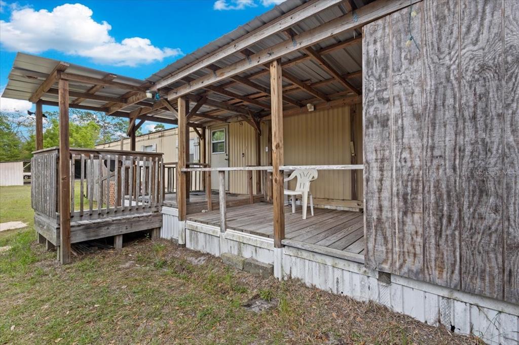 3100 Northwest 20th Street Bell, FL 32619 - Photo 8 of 39 a view of a backyard with wooden fence