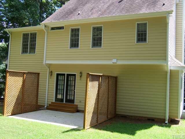 7229 Mine Shaft Road Raleigh, NC 27615 - Photo 6 of 6 a view of a house with a door and a yard
