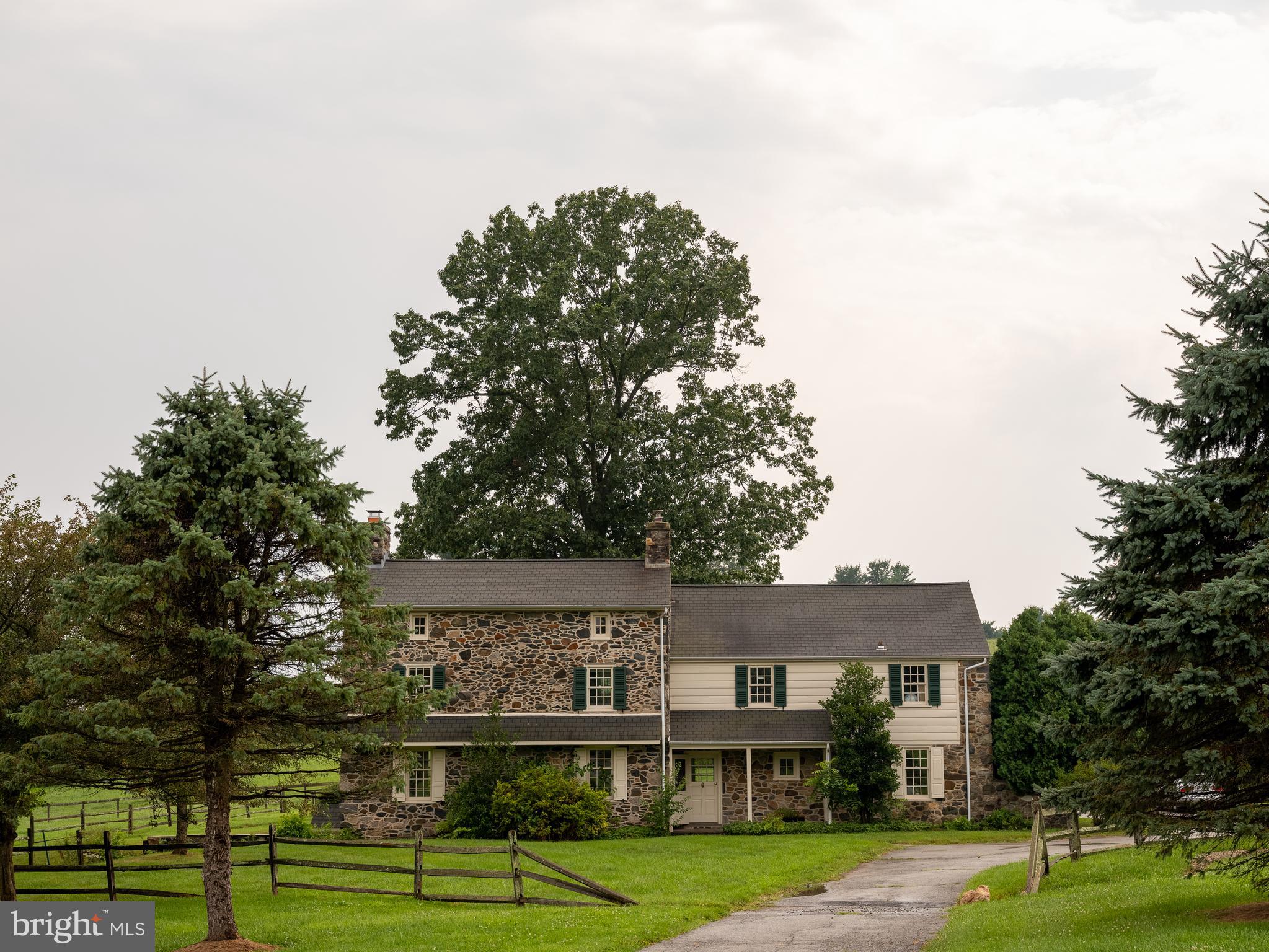 944 Providence Road Newtown Square, PA 19073 - Photo 15 of 20 a front view of a residential apartment building with a yard