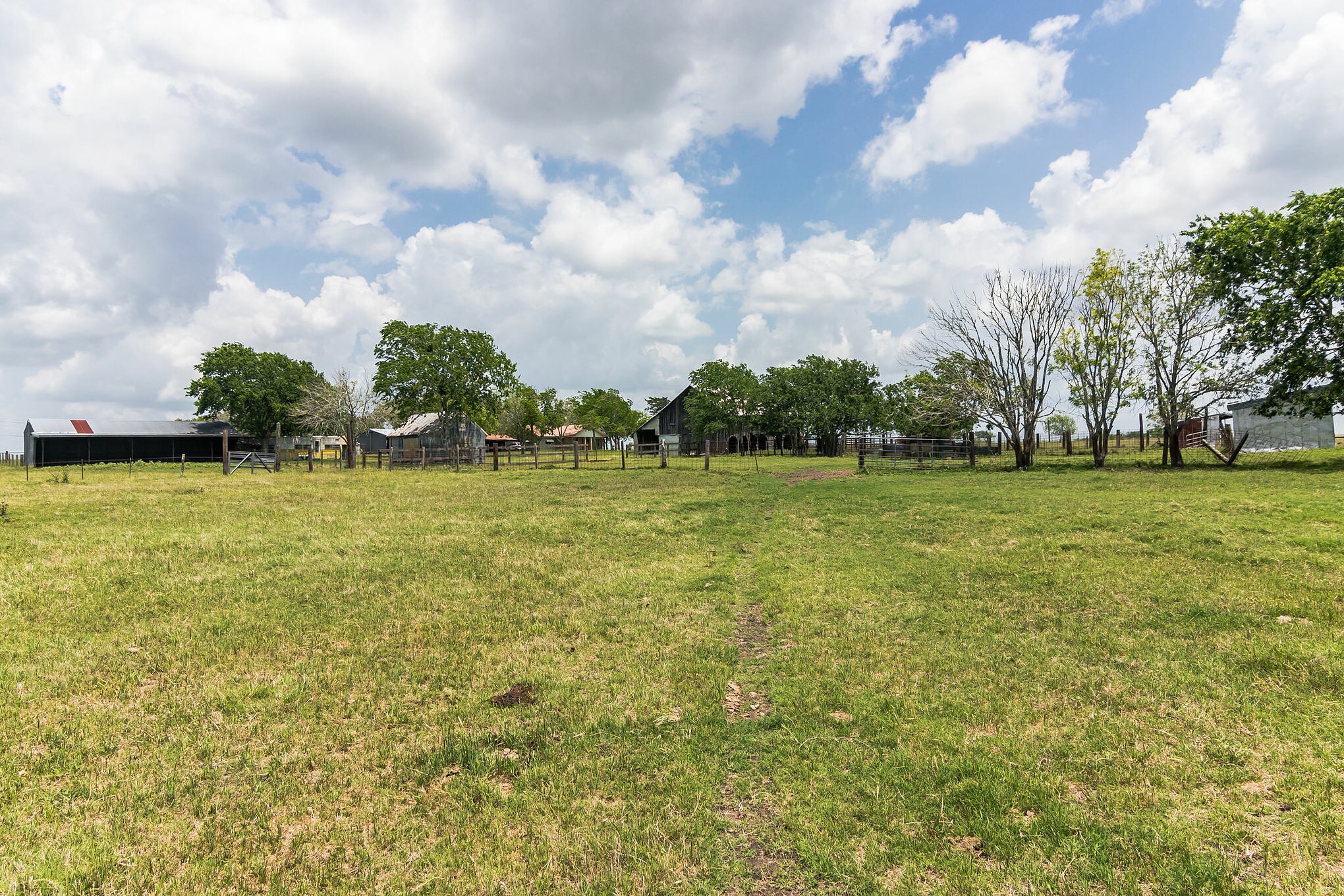 1230 FM 155 Weimar, TX 78962 - Photo 15 of 27 a view of a green field with wooden fence