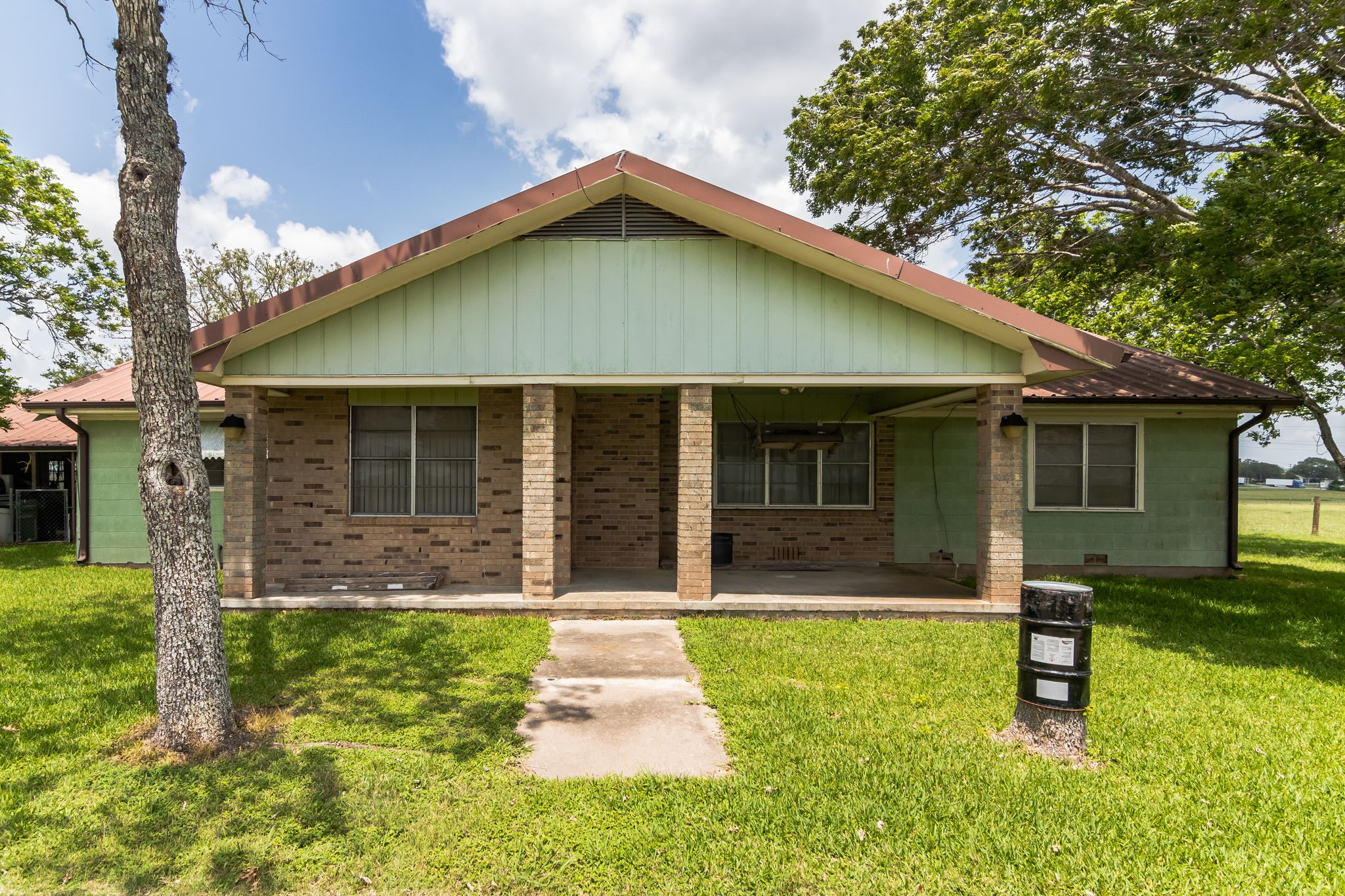 1230 FM 155 Weimar, TX 78962 - Photo 20 of 27 a front view of a house with a yard